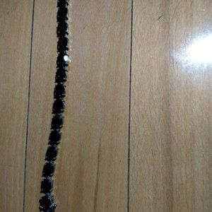 ALX: Smokey quartz sterling silver tennis bracelet.